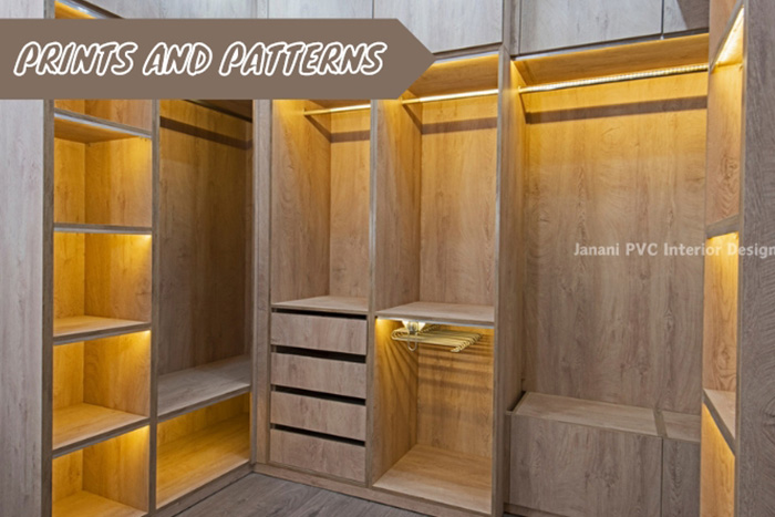 Custom PVC wardrobe by Janani PVC Interior Design in Bengaluru, showcasing elegant wood-like prints and patterns with integrated lighting for a luxurious closet experience