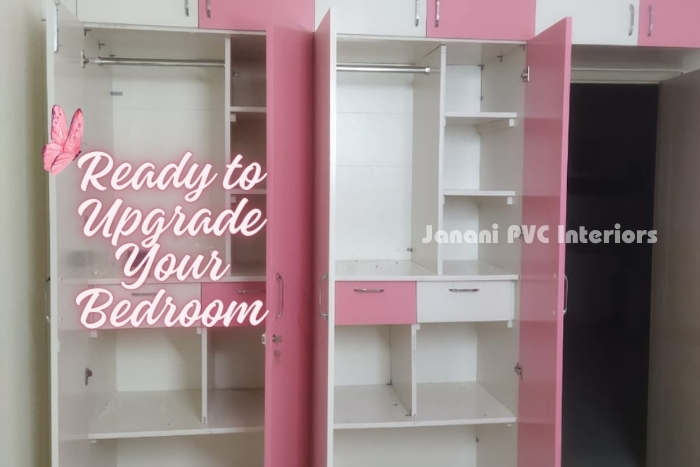 Spacious pink and white open PVC wardrobes designed by Janani PVC Interiors in Bengaluru, ready to upgrade and organize your bedroom with stylish and functional storage solutions