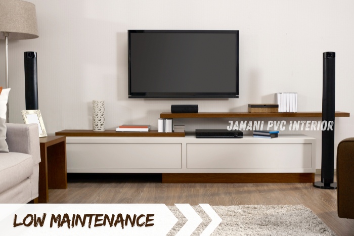 Stylish and low-maintenance PVC TV unit by Janani PVC Interior Design in Bengaluru, featuring sleek white and wood finishes with integrated shelves and ample storage space. Perfect for modern living rooms, combining elegance with functionality