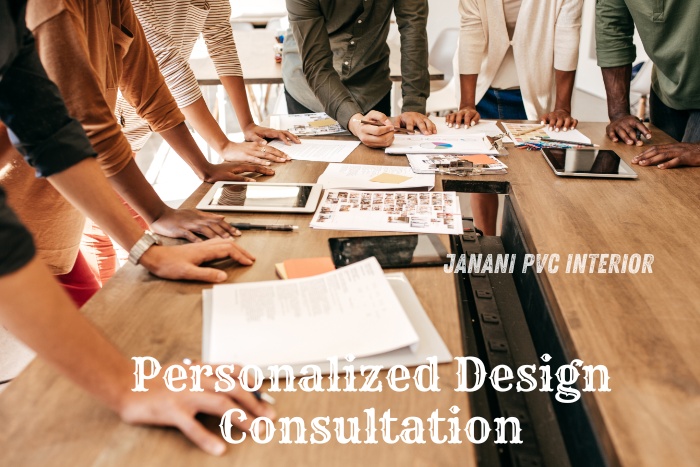 Personalized Design Consultation by Janani PVC Interior Design in Bengaluru. Group of designers collaborating over design plans and samples on a wooden table, offering customized PVC interior solutions for your home